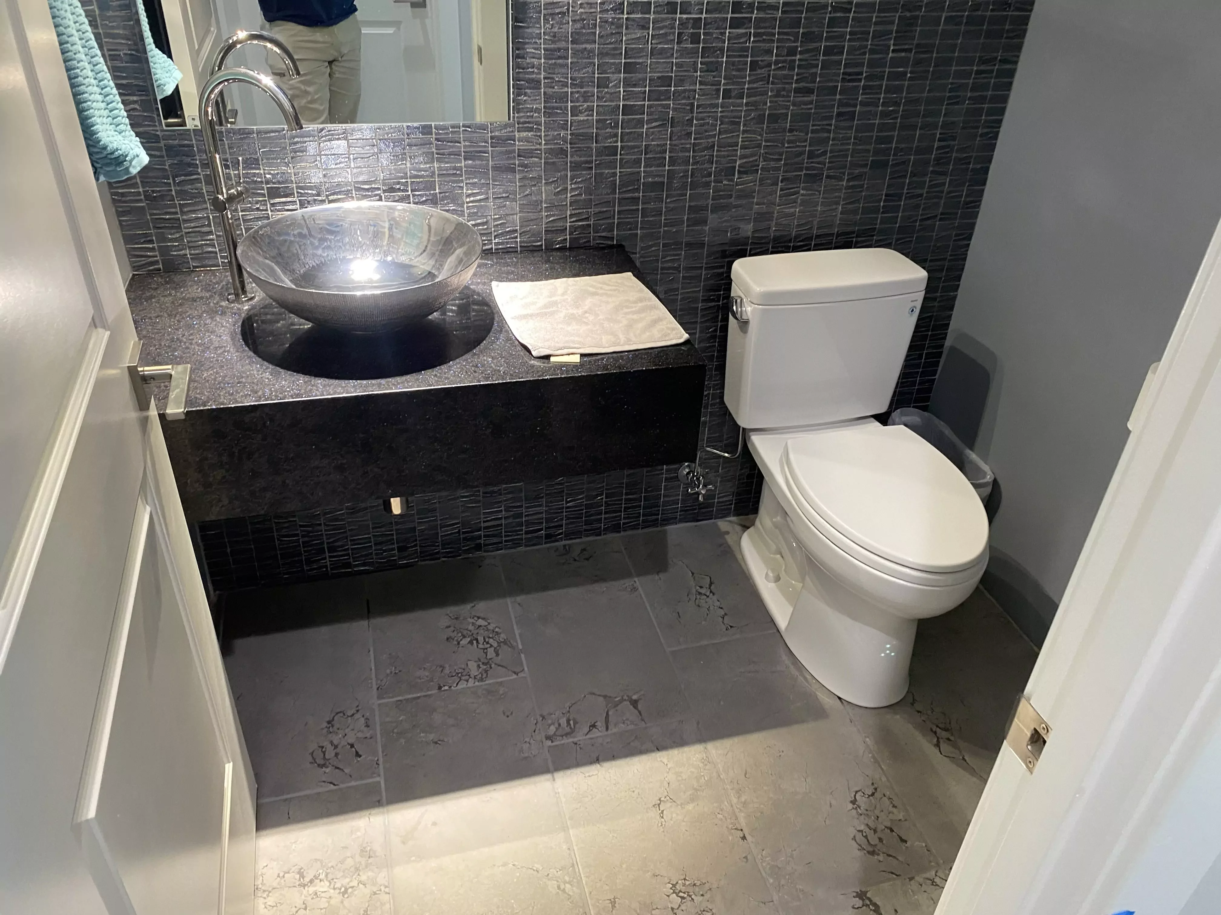 bathroom sink with a slow-draining pop-up stopper serviced by a Peoria plumber