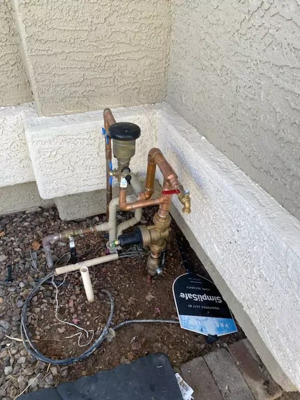 whole-house water treatment plumbing connections installed in a Surprise, AZ home